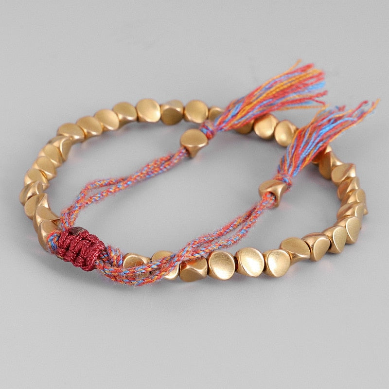 "Embrace Serenity, Wear Eternity: Experience the Spiritual Connection of our Handmade Tibetan Buddhist Braided Copper Beads Lucky Rope Bracelet"